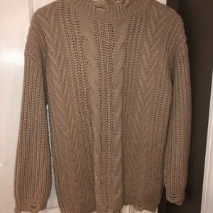 Distressed chunky cable knit sweater